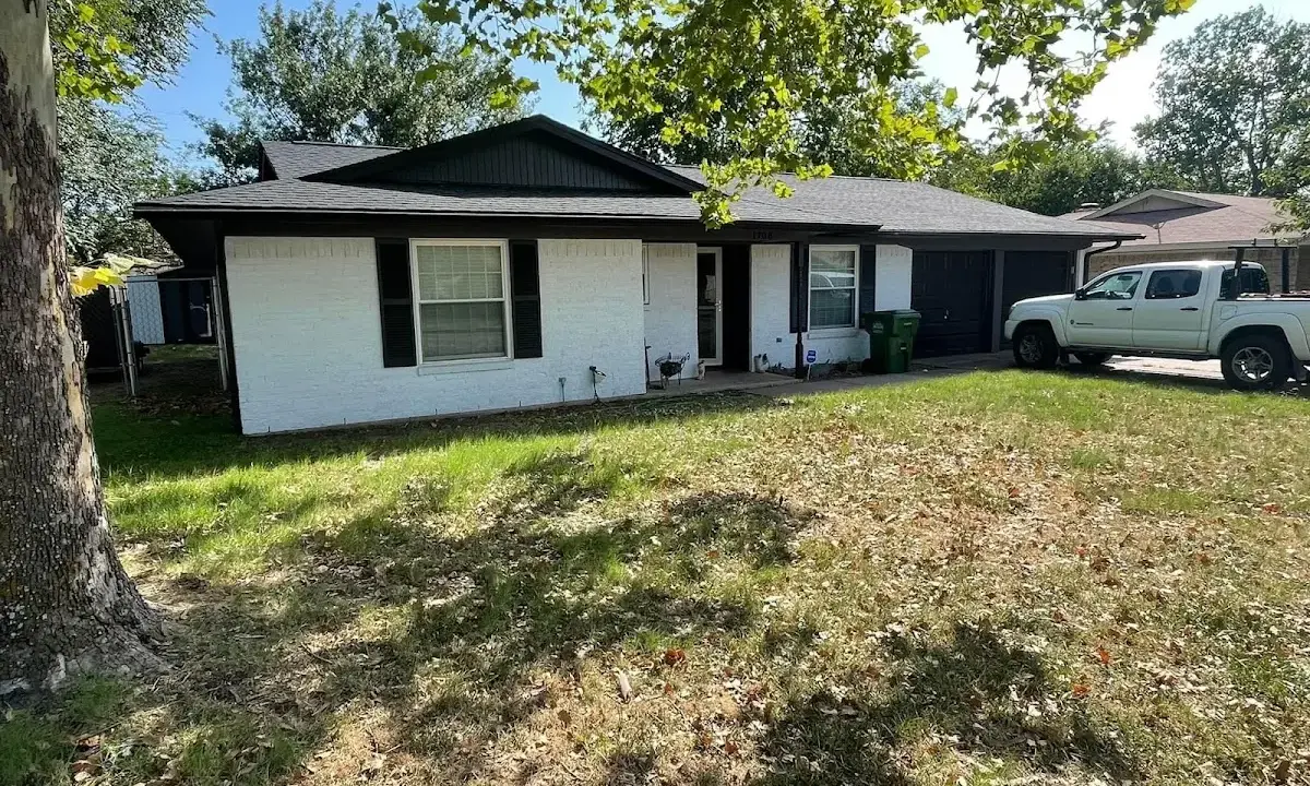 Professional roofing crew working on a residential roof in Santa Teresa